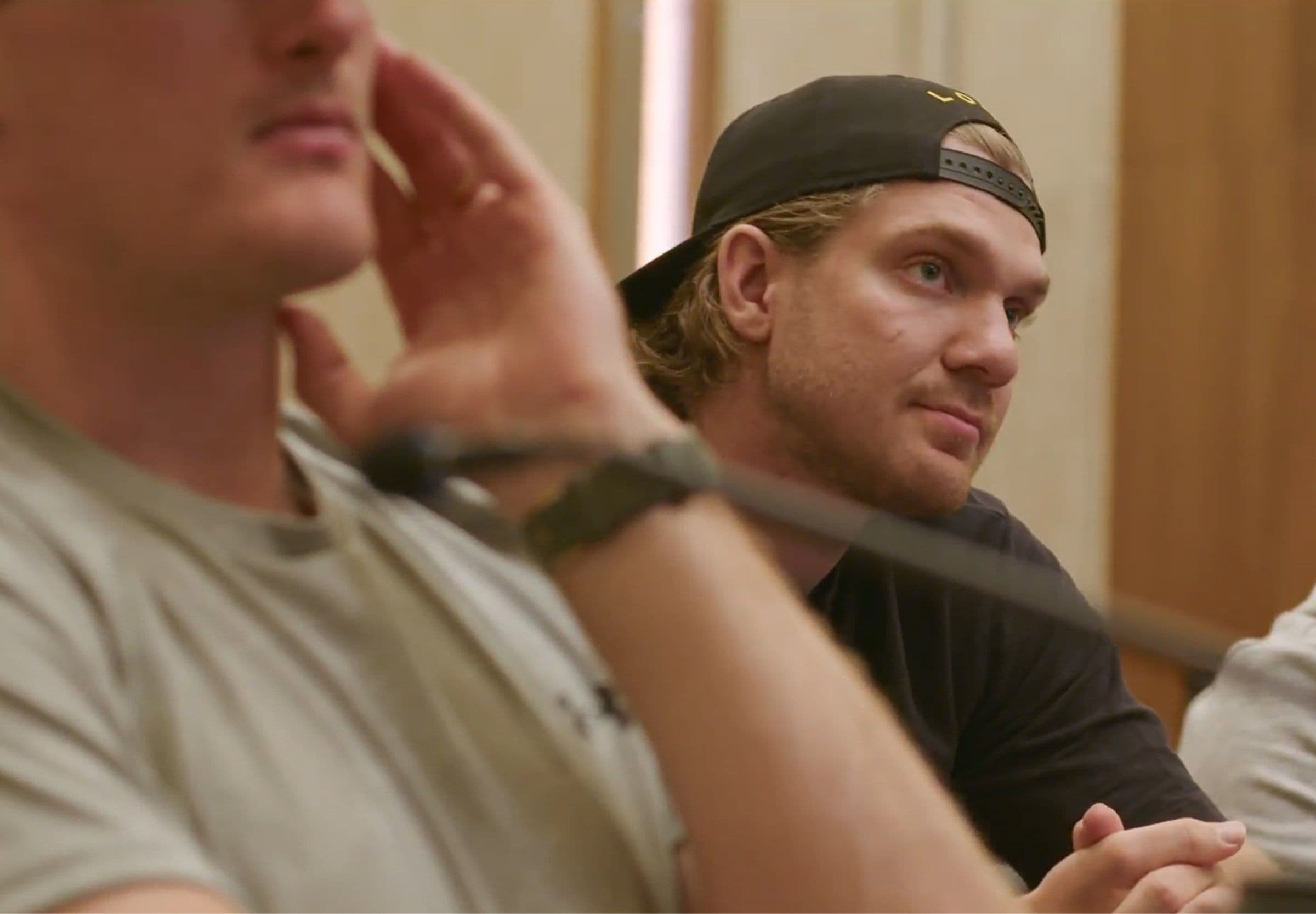 Two NHL players sitting in a press conference