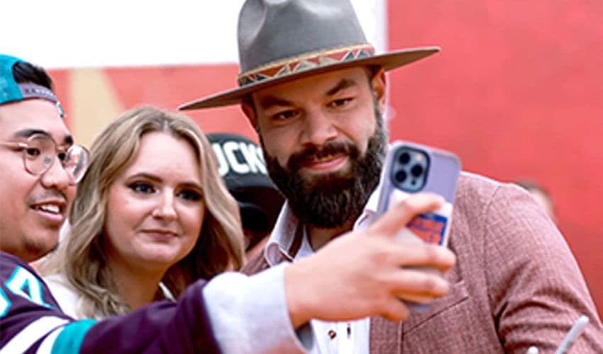 NHLPA Health and Wellness Radko Gudas taking pictures with fans